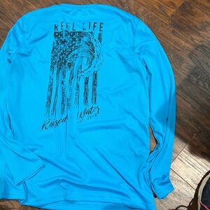 Reel life shirt, size large ride, the wave these beautiful redbl